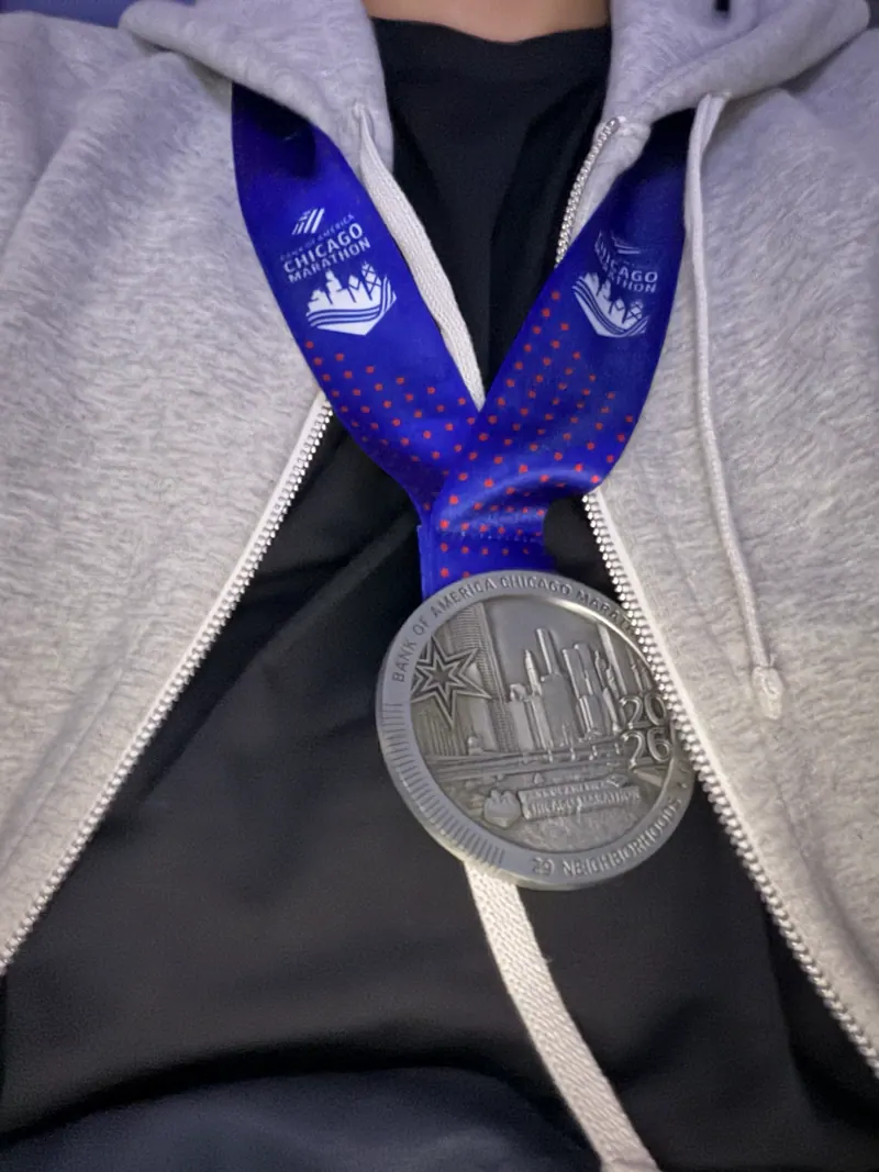 Still wearing the medal on the flight home.