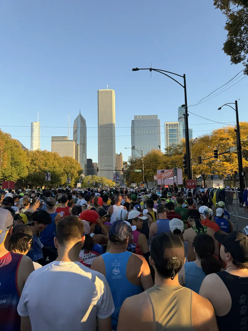 Runners waiting to start, with Chicago's buildings ahead.